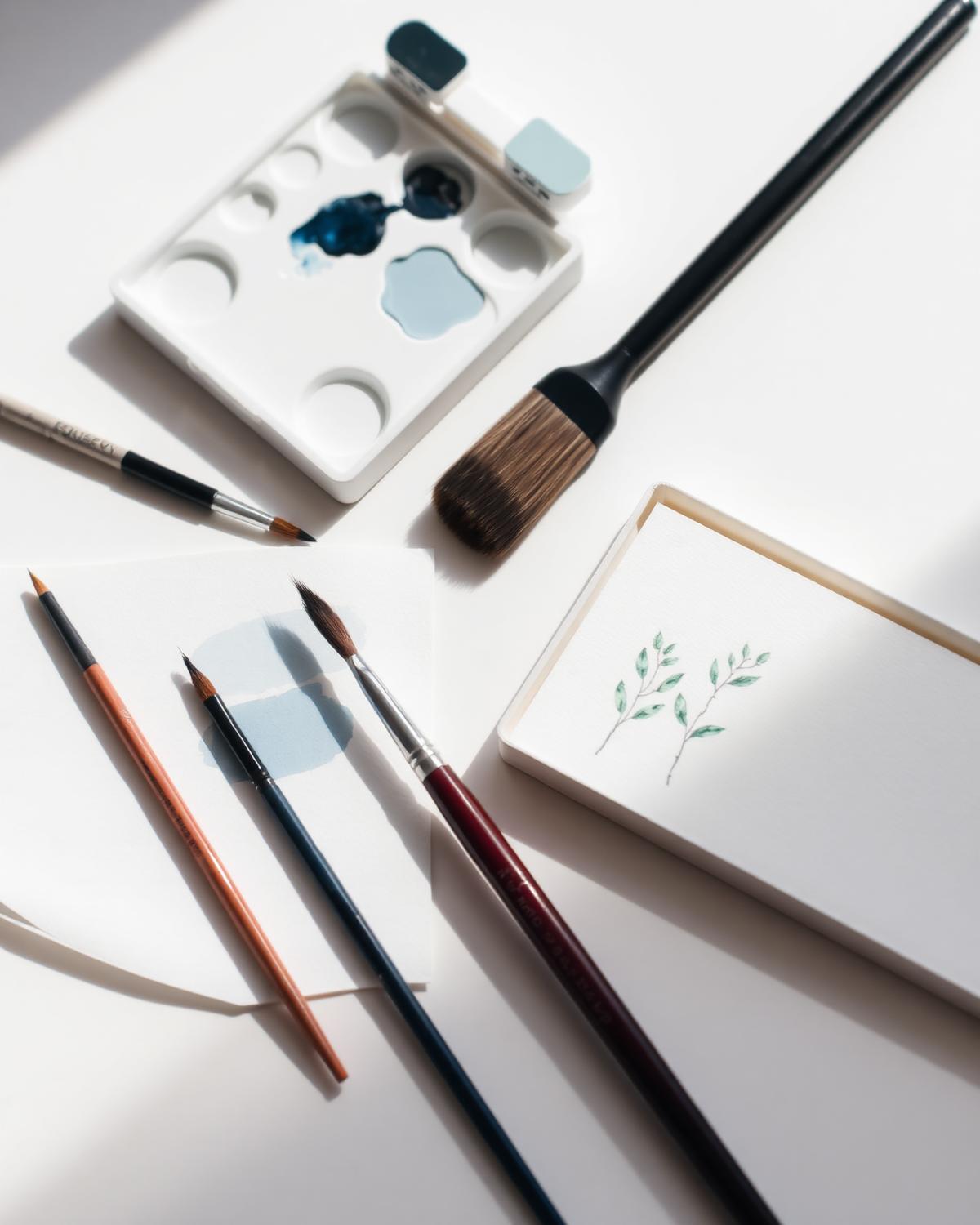 Watercolour and brushes on a quiet desk